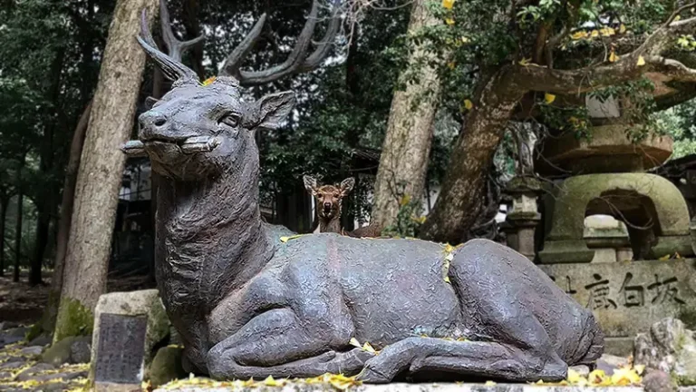 deer statue and deer in nara